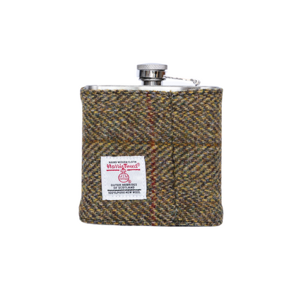 Harris Tweed hip flask with a visible brand label on a white background