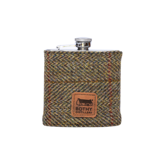 Harris Tweed hip flask with a visible brand logo on a white background